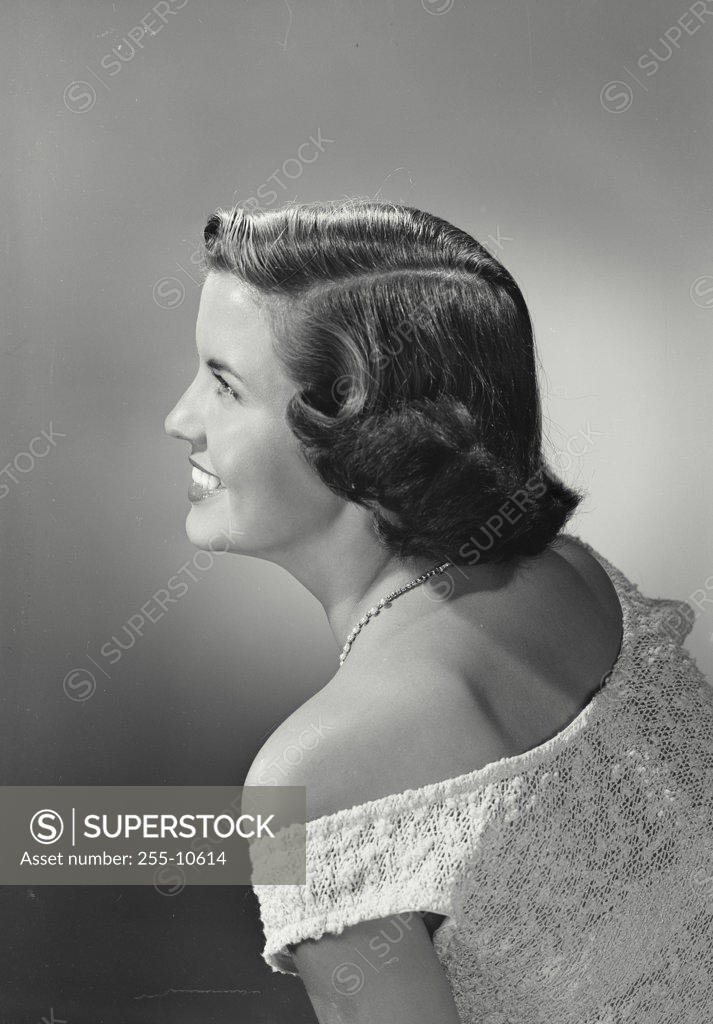 Stock Photo: 255-10614 Side profile of a young woman smiling