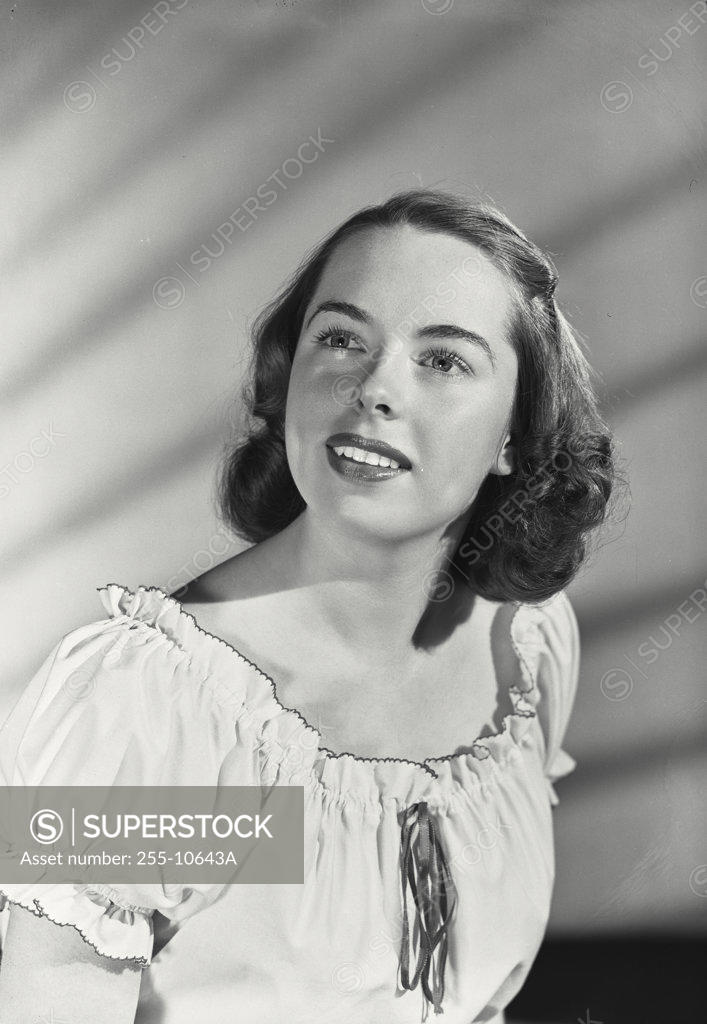 Stock Photo: 255-10643A Close-up of a young woman looking up