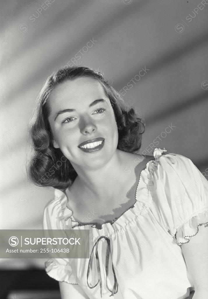 Stock Photo: 255-10643B Close-up of a young woman smiling