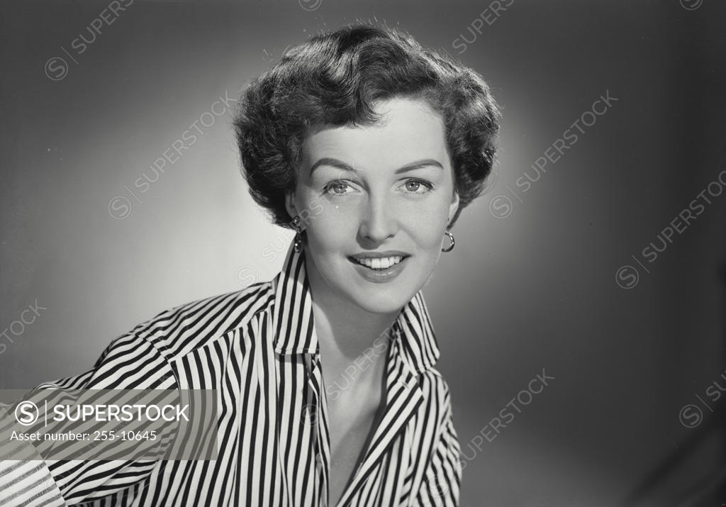 Stock Photo: 255-10645 Portrait of a young woman smiling