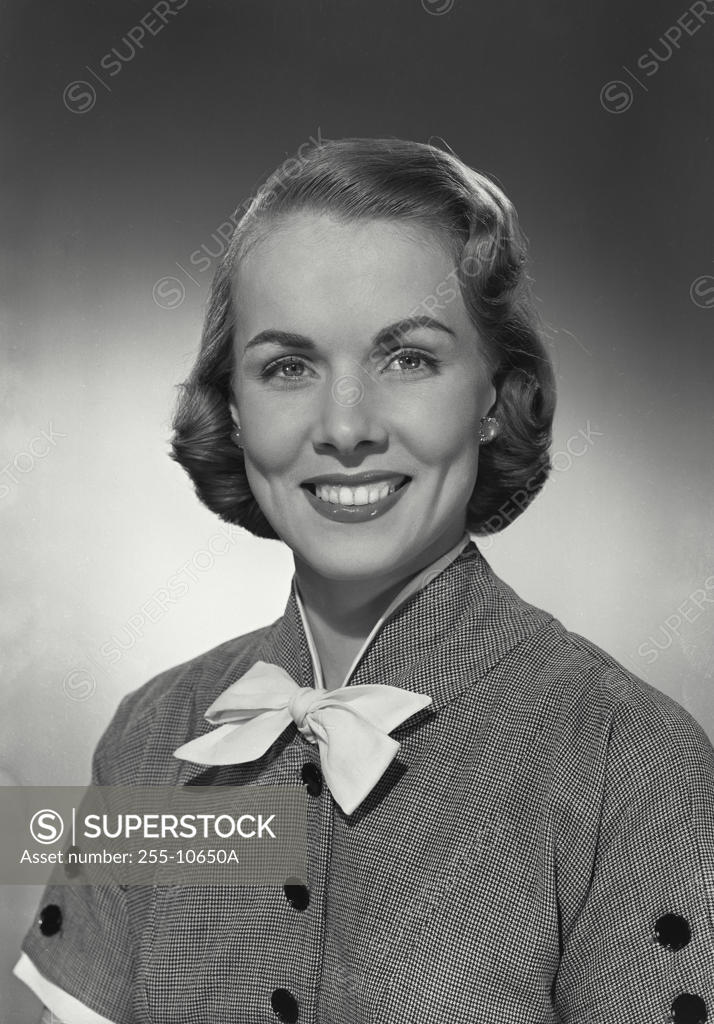 Stock Photo: 255-10650A Portrait of a young woman smiling