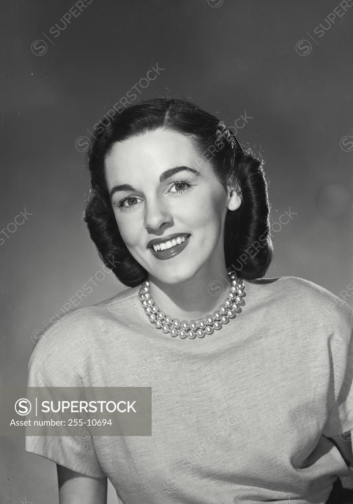 Stock Photo: 255-10694 Portrait of a young woman smiling