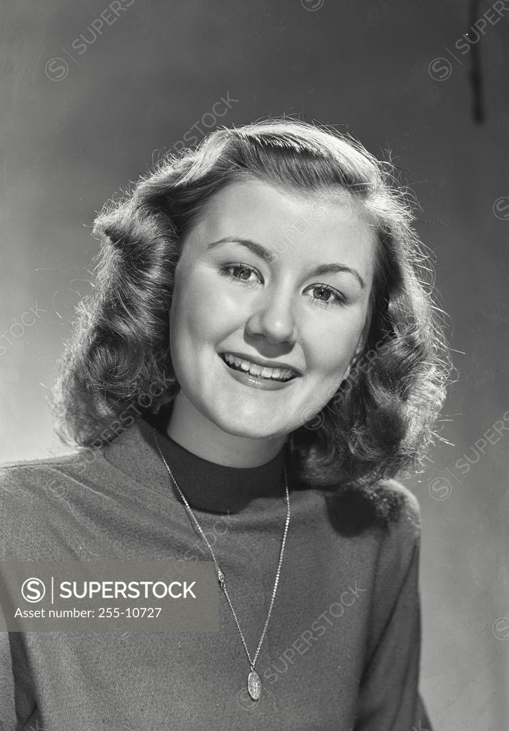 Stock Photo: 255-10727 Portrait of a young woman smiling