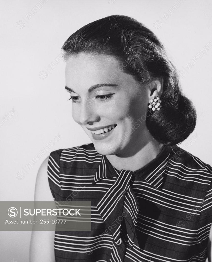 Stock Photo: 255-10777 Close-up of a young woman looking down
