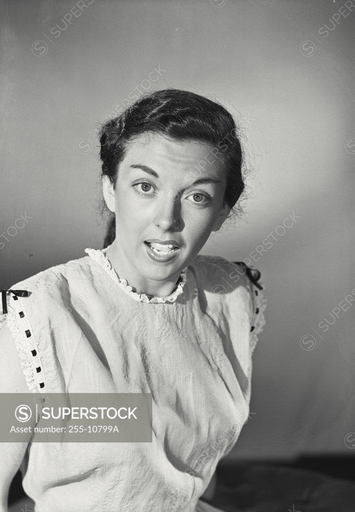Stock Photo: 255-10799A Portrait of a young woman looking surprised