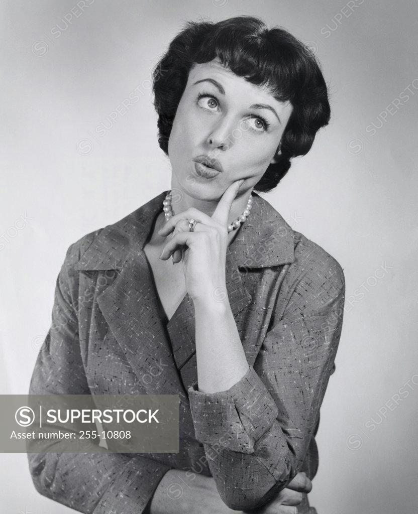 Stock Photo: 255-10808 Young woman thinking