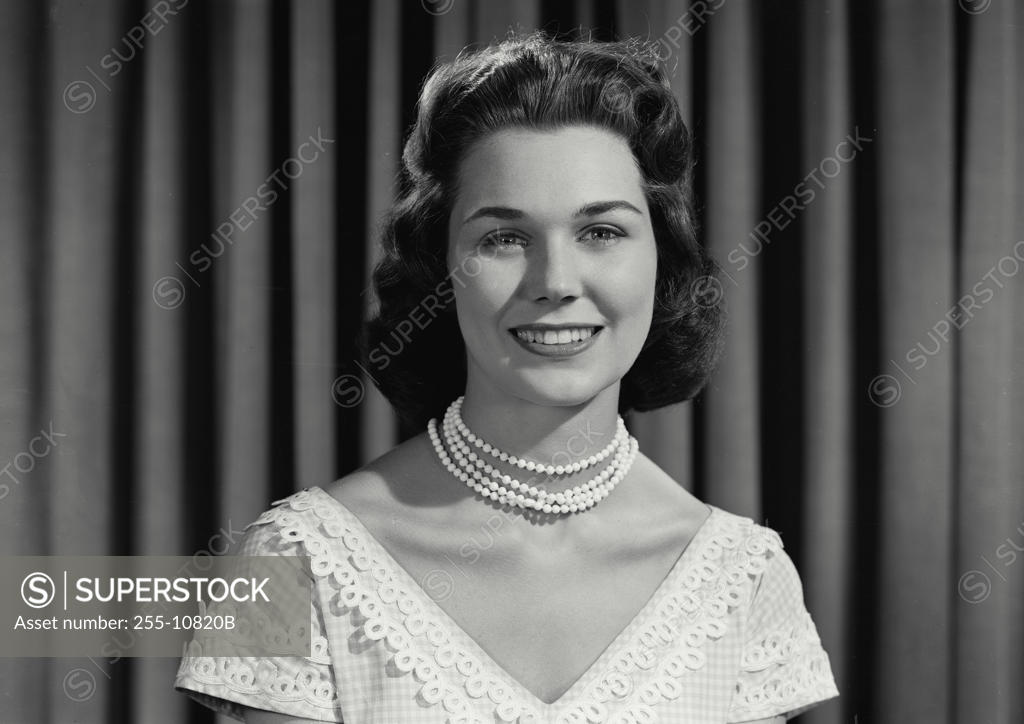 Stock Photo: 255-10820B Portrait of a young woman smiling