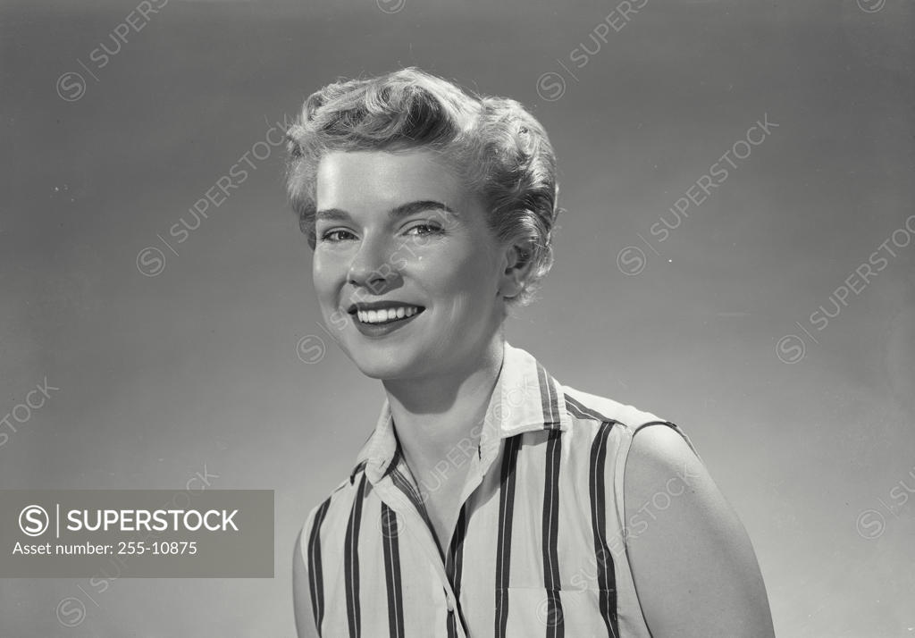 Stock Photo: 255-10875 Portrait of a young woman smiling