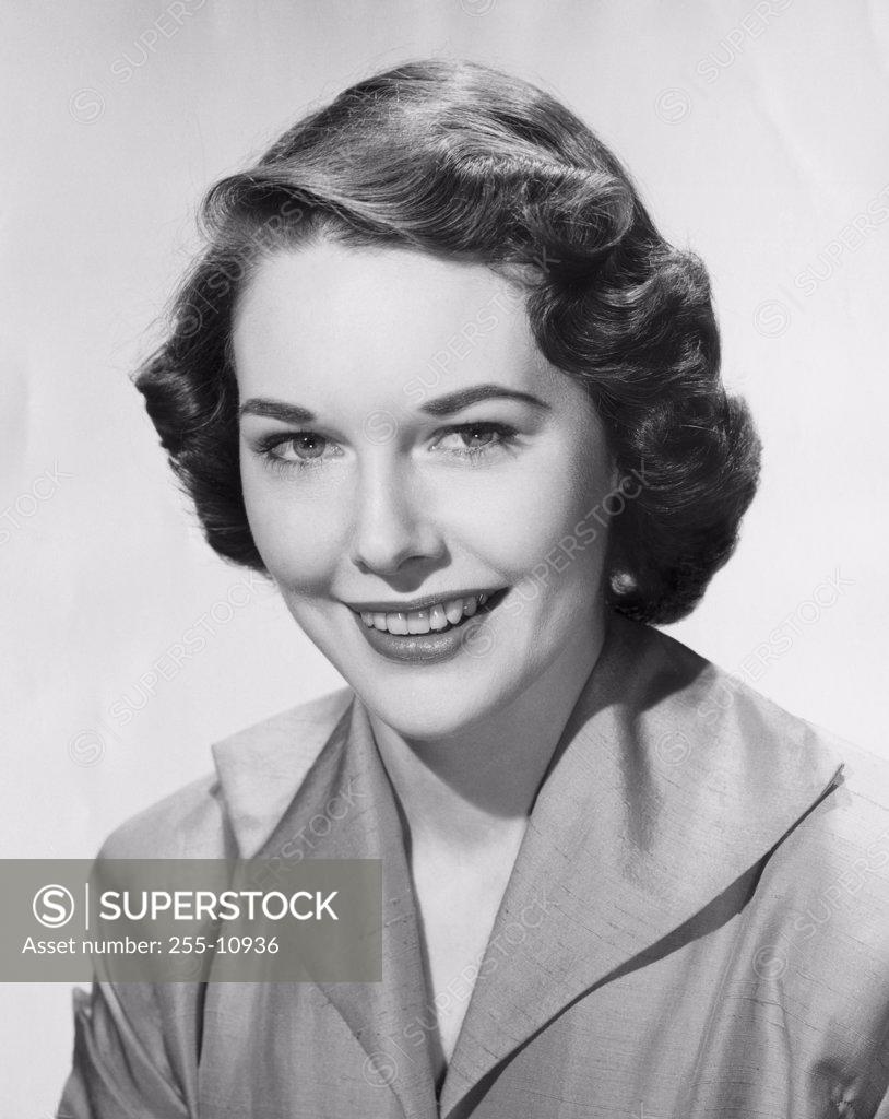 Stock Photo: 255-10936 Portrait of a young woman smiling