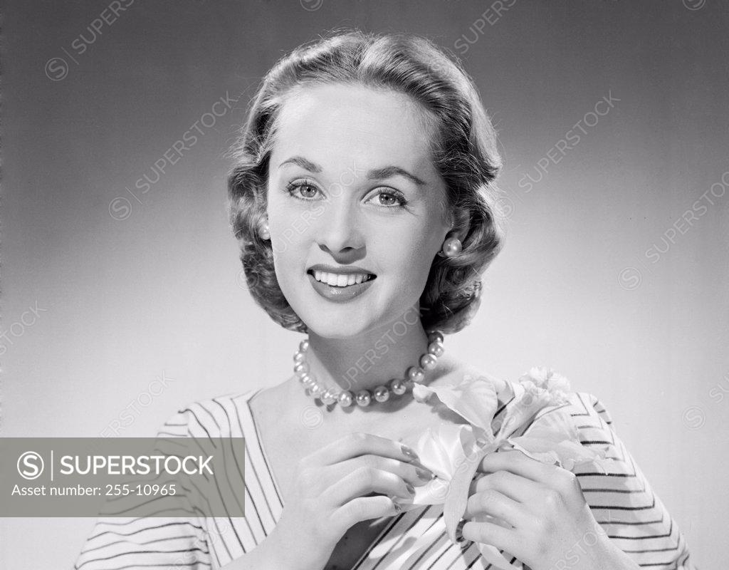 Stock Photo: 255-10965 Portrait of a young woman smiling