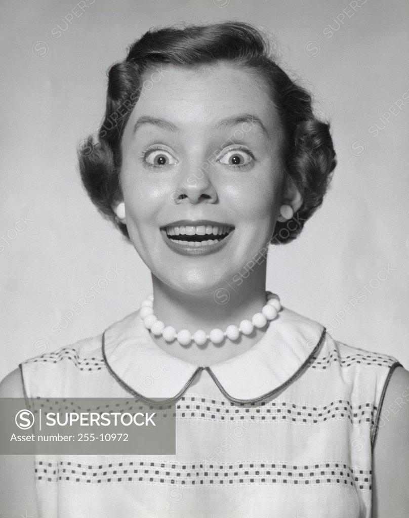 Stock Photo: 255-10972 Portrait of a young woman looking surprised
