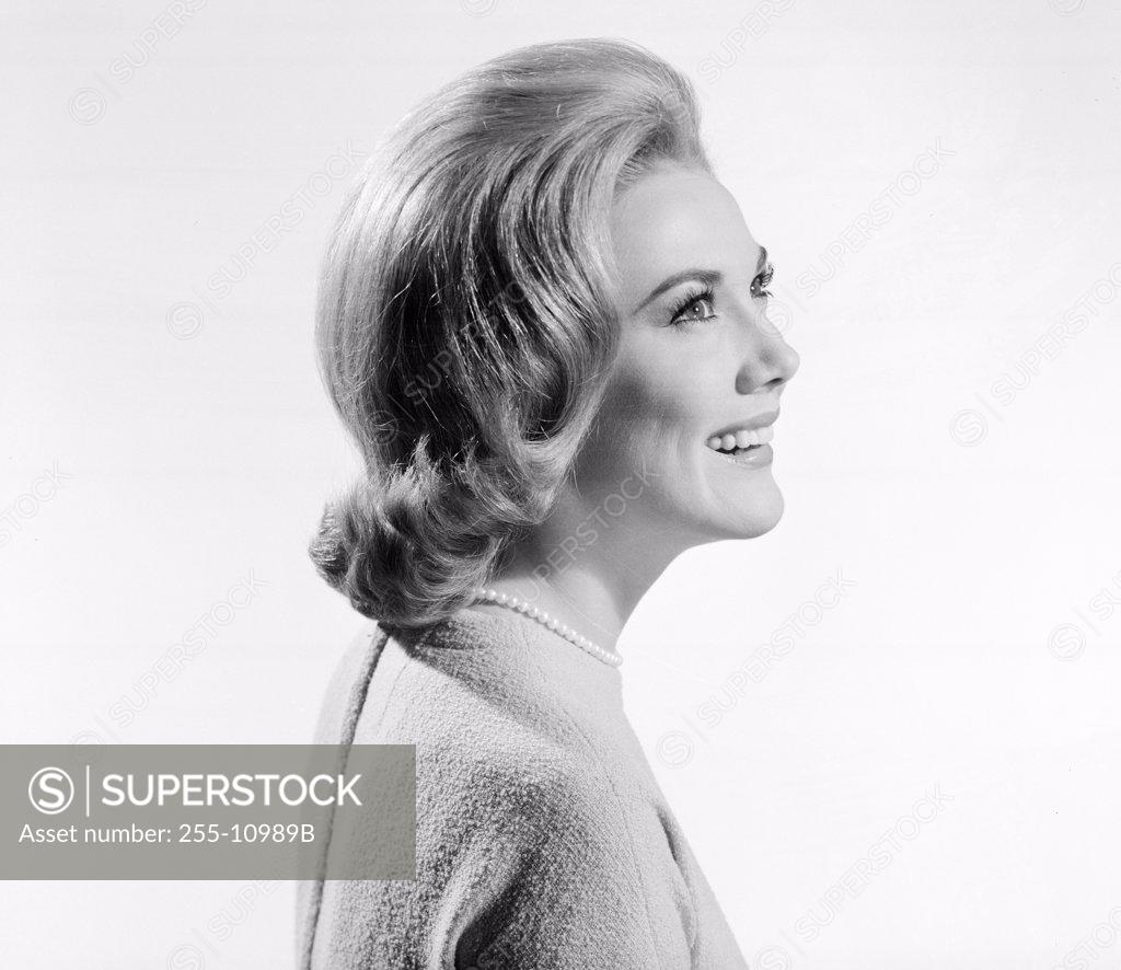 Stock Photo: 255-10989B Side profile of a young woman smiling
