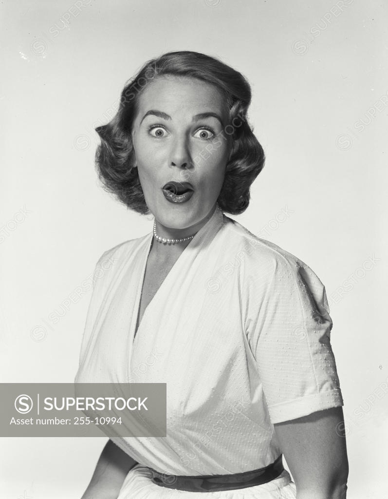 Stock Photo: 255-10994 Portrait of a young woman looking surprised