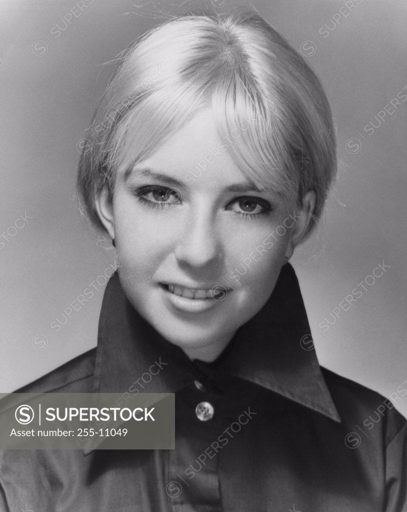 Stock Photo: 255-11049 Portrait of a young woman smiling