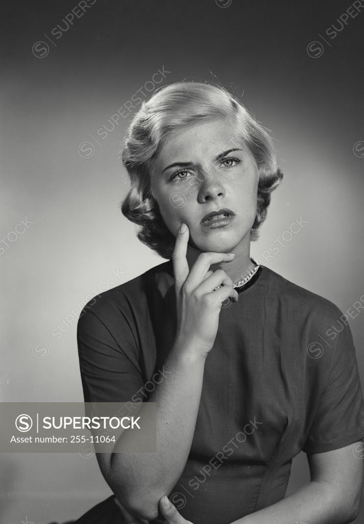 Stock Photo: 255-11064 Close-up of a young woman thinking