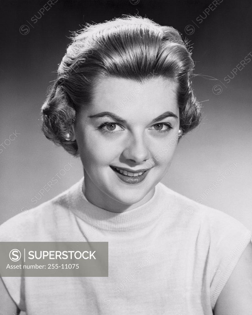 Stock Photo: 255-11075 Portrait of a young woman smiling