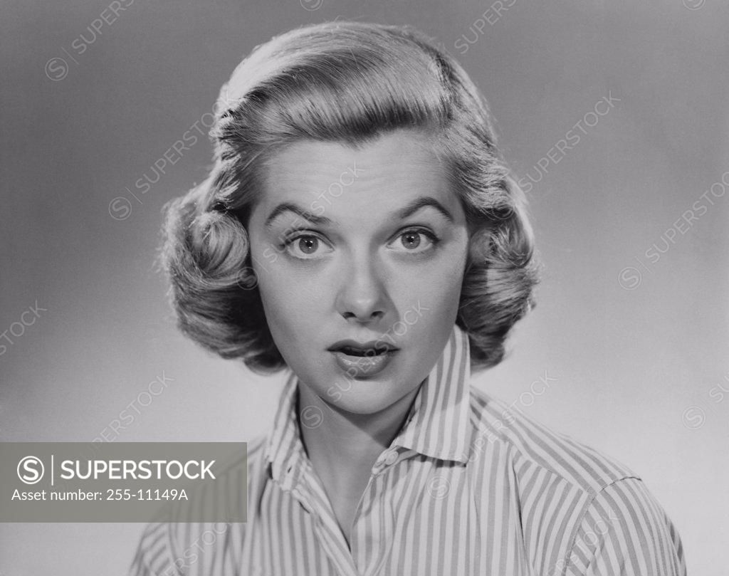 Stock Photo: 255-11149A Portrait of a young woman looking surprised