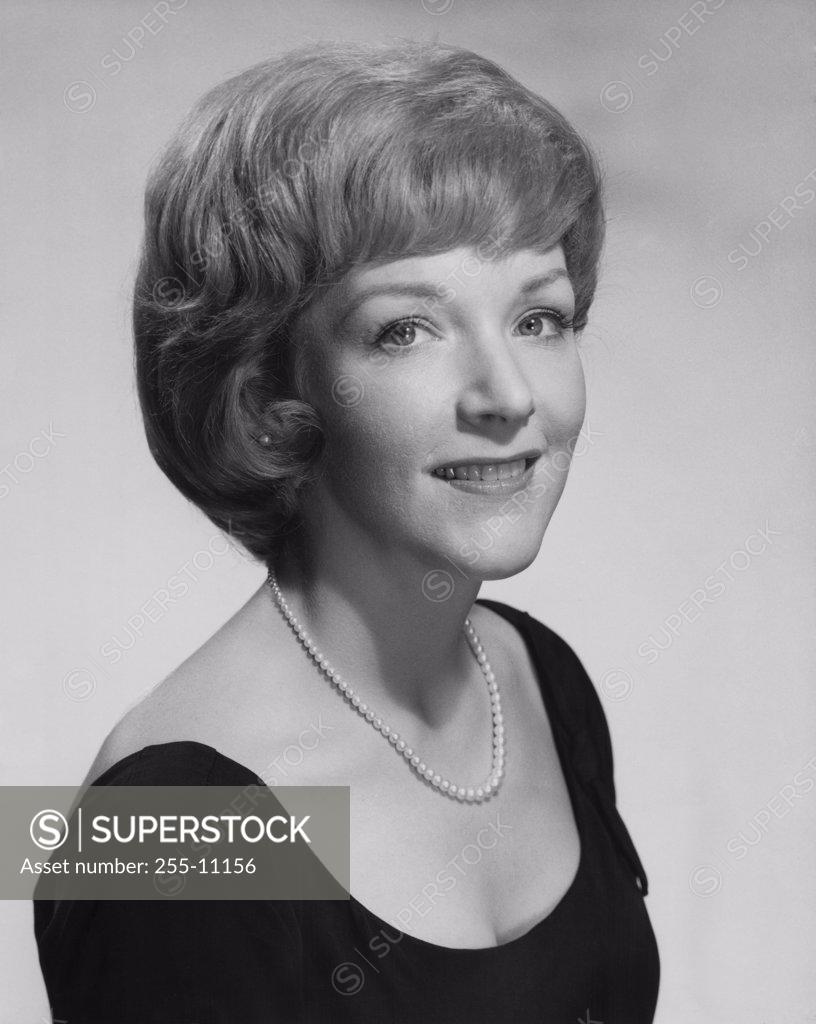 Stock Photo: 255-11156 Portrait of a young woman smiling