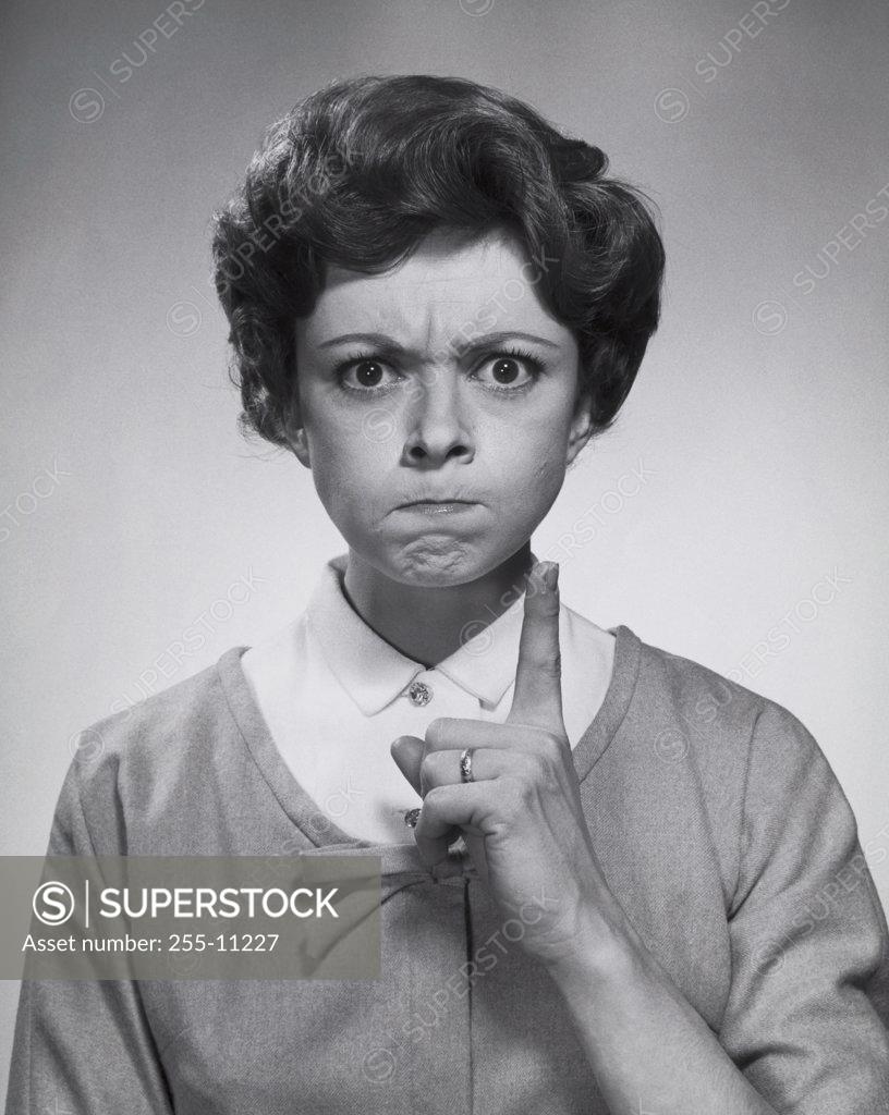 Stock Photo: 255-11227 Portrait of a young woman looking angry