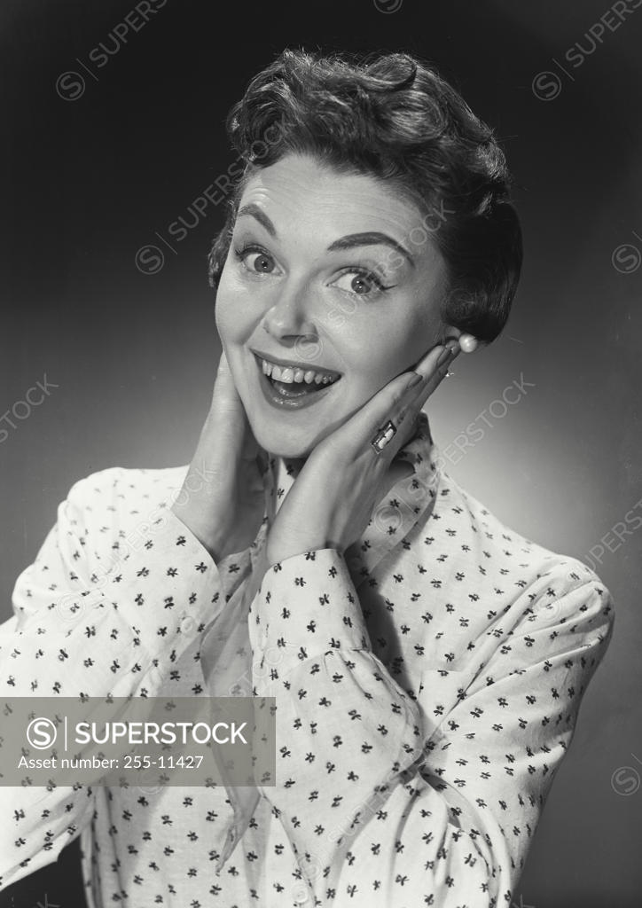 Stock Photo: 255-11427 Portrait of a mid adult woman looking surprised