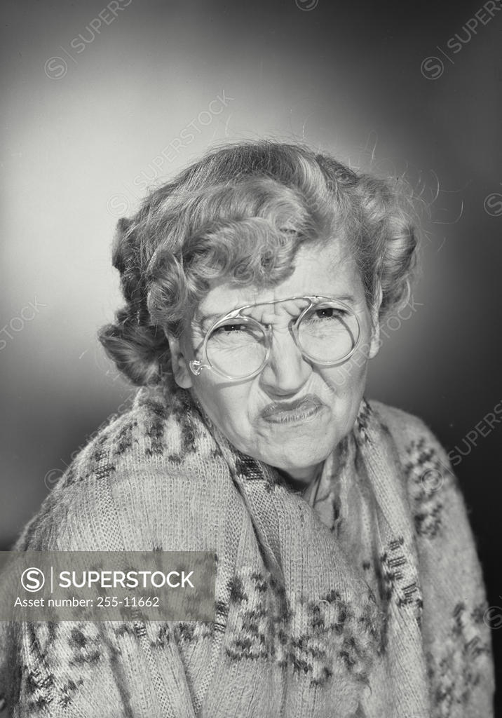 Stock Photo: 255-11662 Portrait of a senior woman making a face