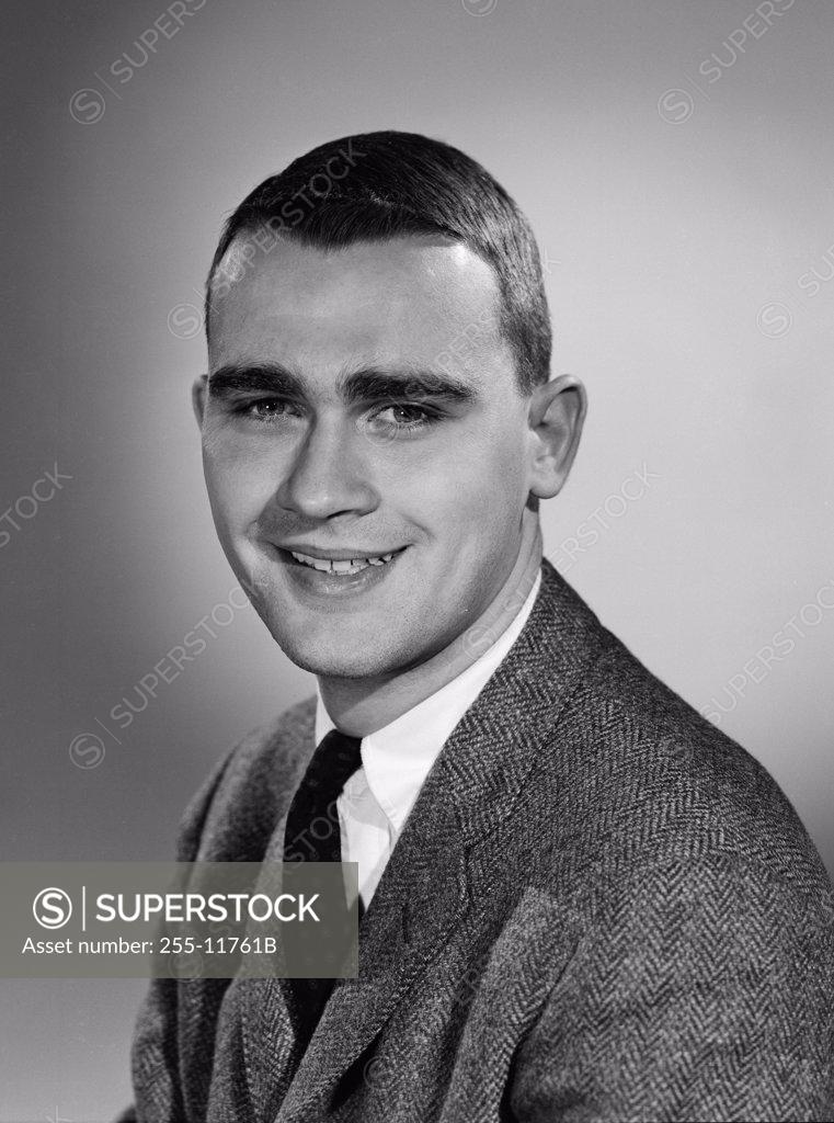 Stock Photo: 255-11761B Studio portrait of businessman smiling