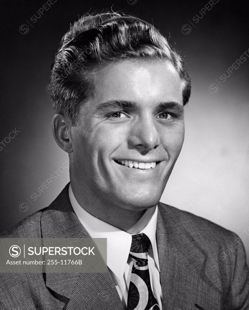 Stock Photo: 255-11766B Studio portrait of businessman smiling