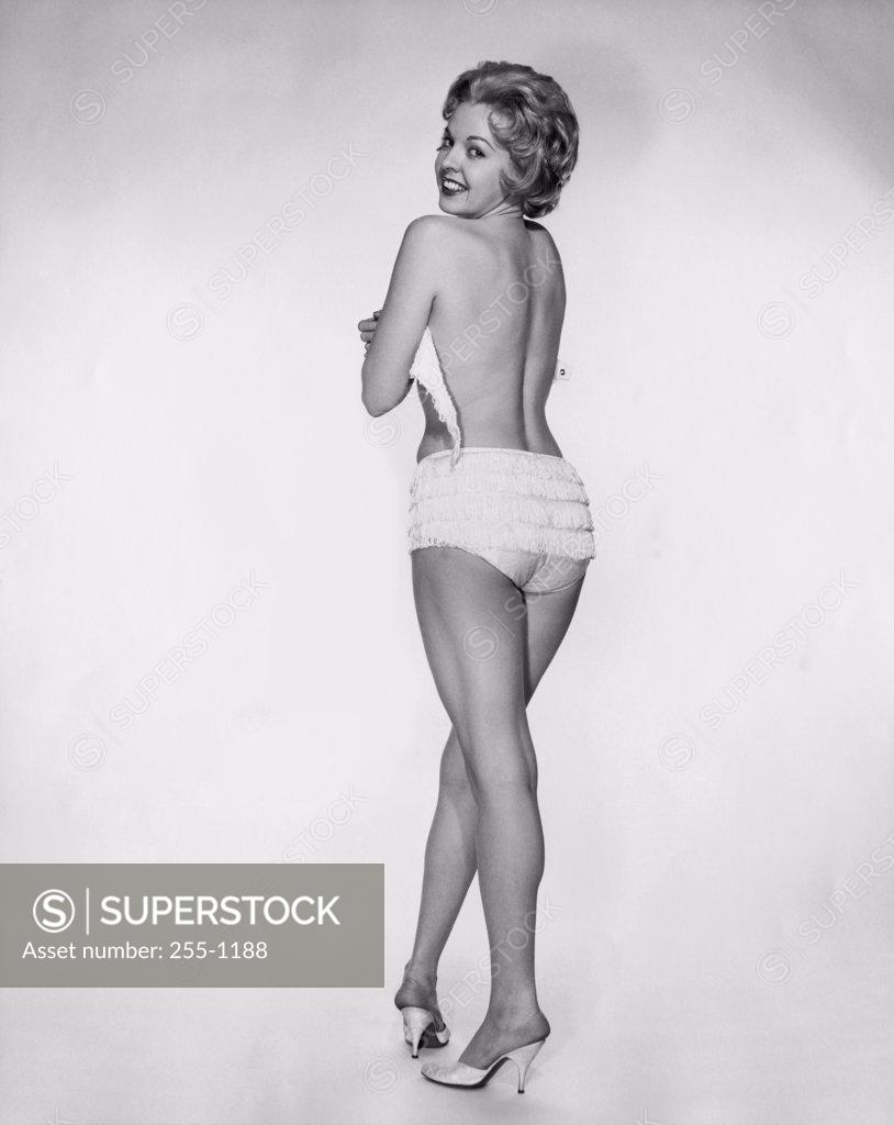 Stock Photo: 255-1188 Rear view of young woman looking back
