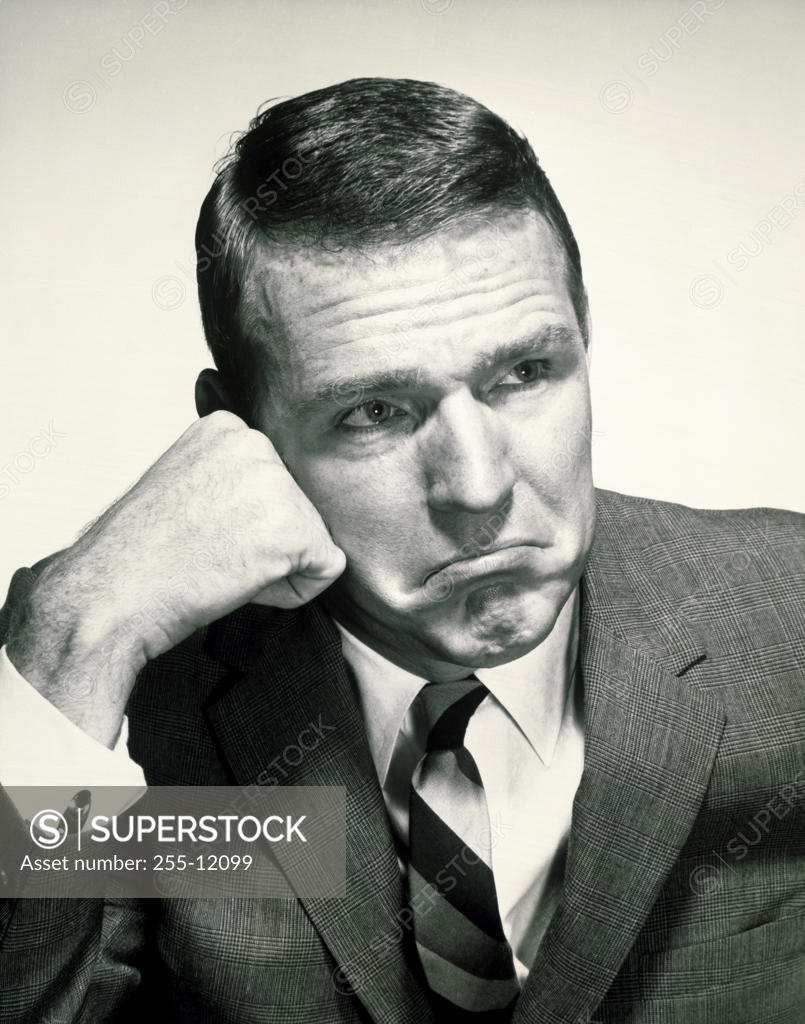 Stock Photo: 255-12099 Close-up of a businessman looking sad