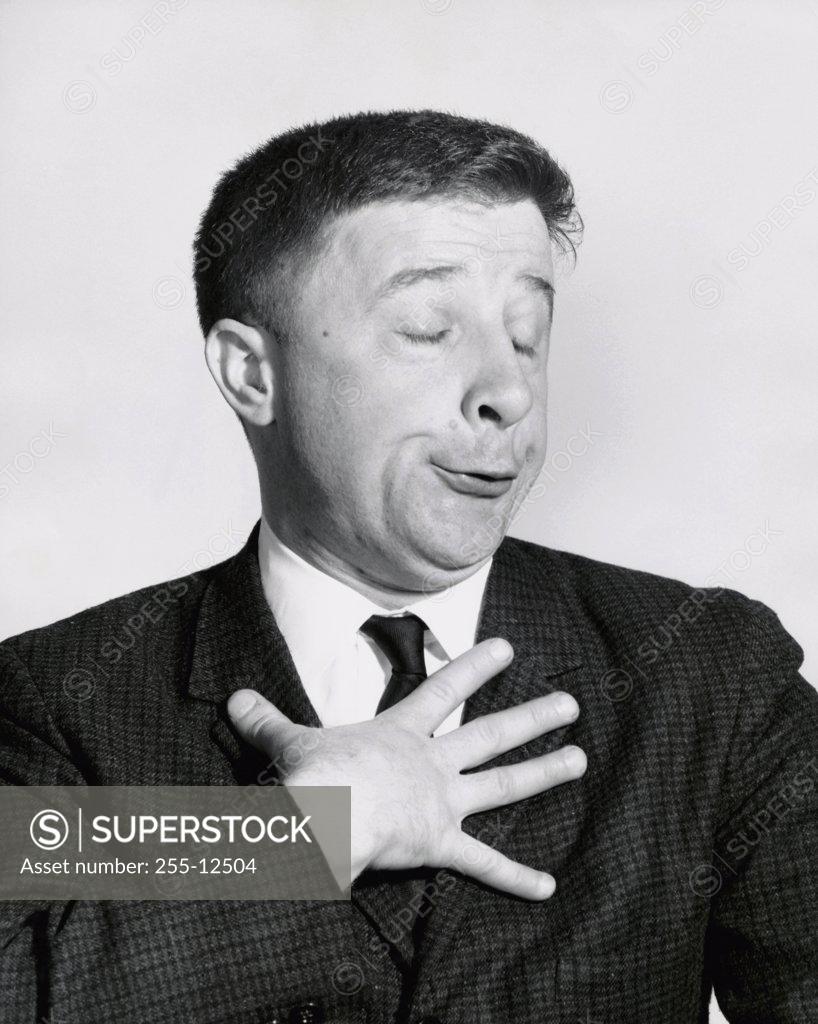 Stock Photo: 255-12504 Close-up of a businessman making a funny face