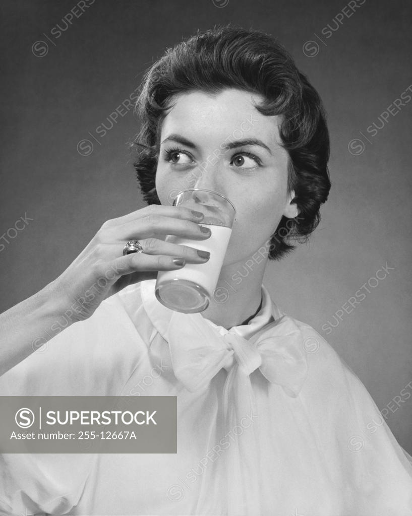 Stock Photo: 255-12667A Close-up of a young woman drinking milk