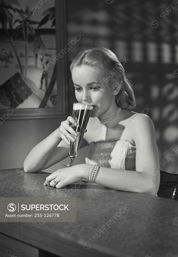 Stock Photo: 255-12677B Close-up of a young woman drinking beer