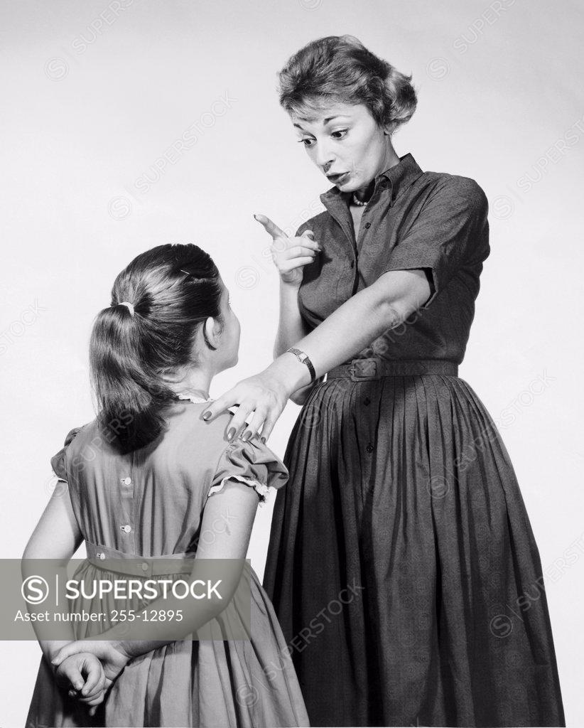 Stock Photo: 255-12895 Mother scolding her daughter