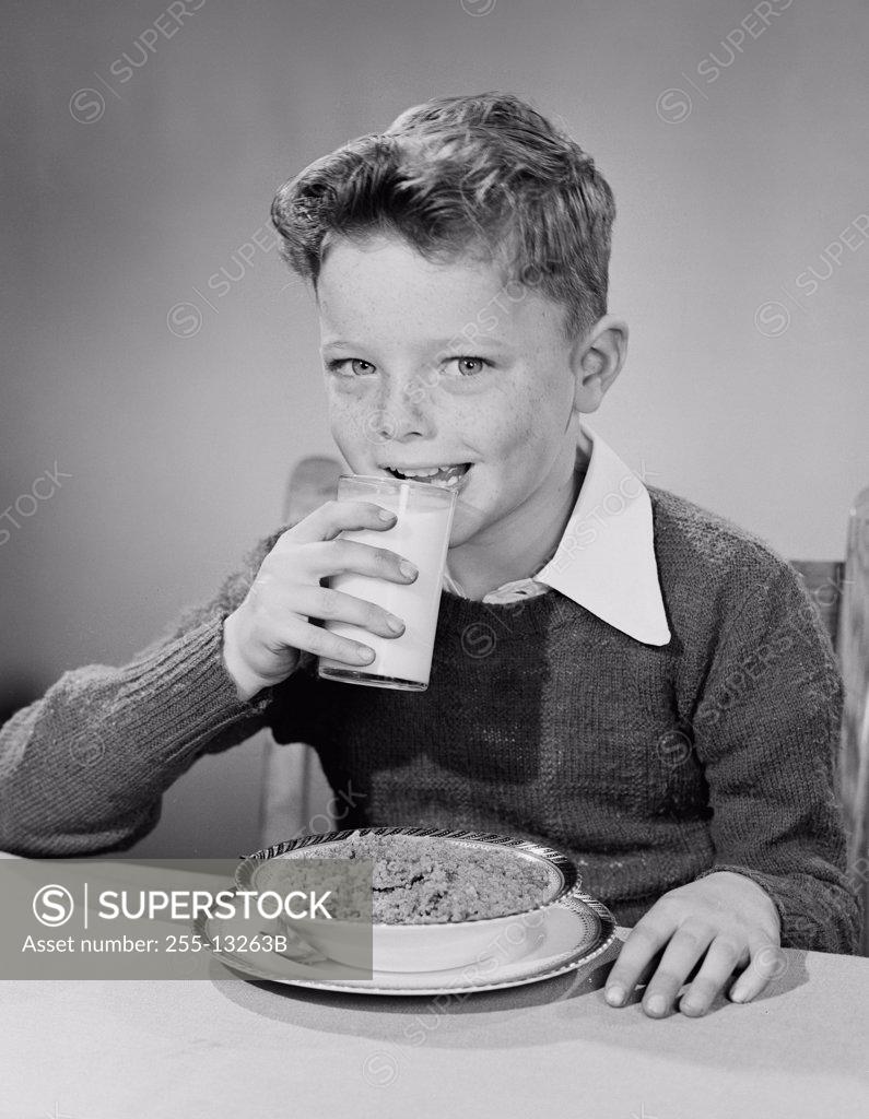 Stock Photo: 255-13263B Portrait of boy drinking milk for breakfast
