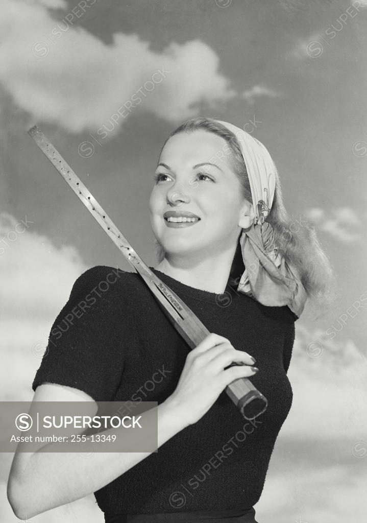 Stock Photo: 255-13349 Close-up of a young woman holding a tennis racket