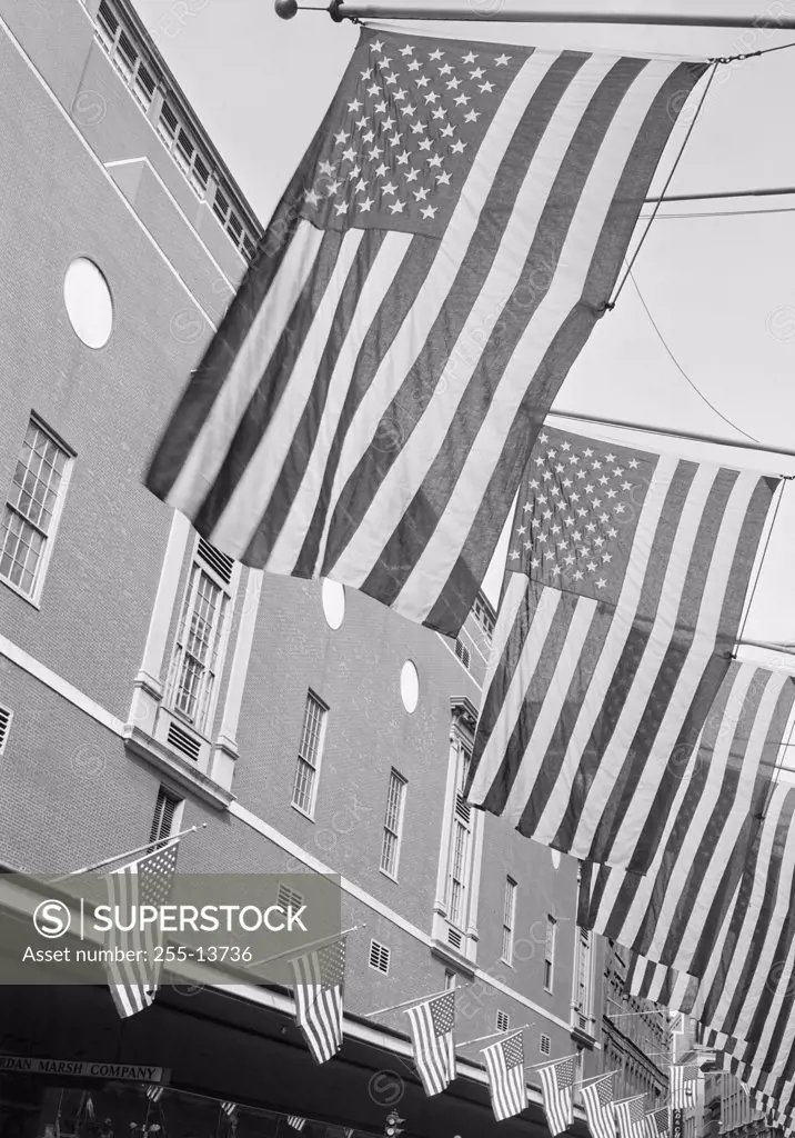 Low angle view of American flags on a building, Memorial Day, Boston, Massachusetts, USA