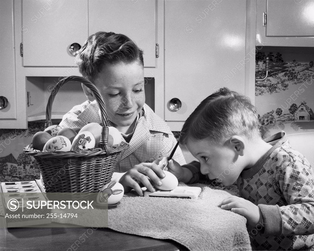 Stock Photo: 255-14794 Two boys painting Easter eggs