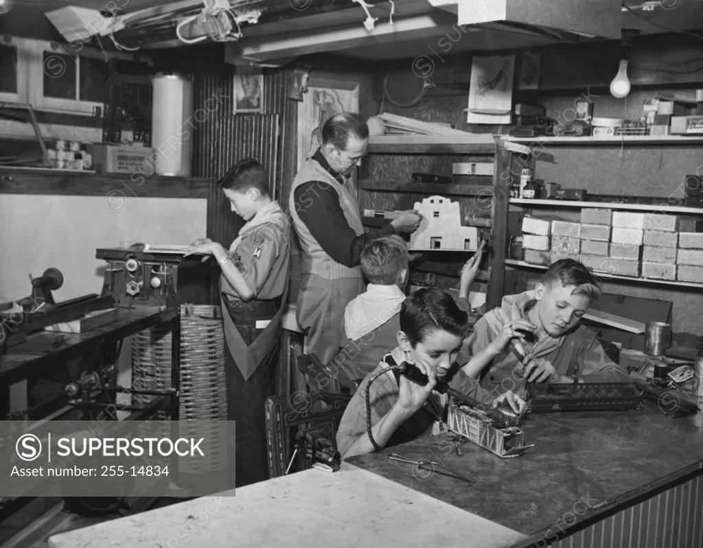 Stock Photo: 255-14834 Boy scouts learning carpentry skills