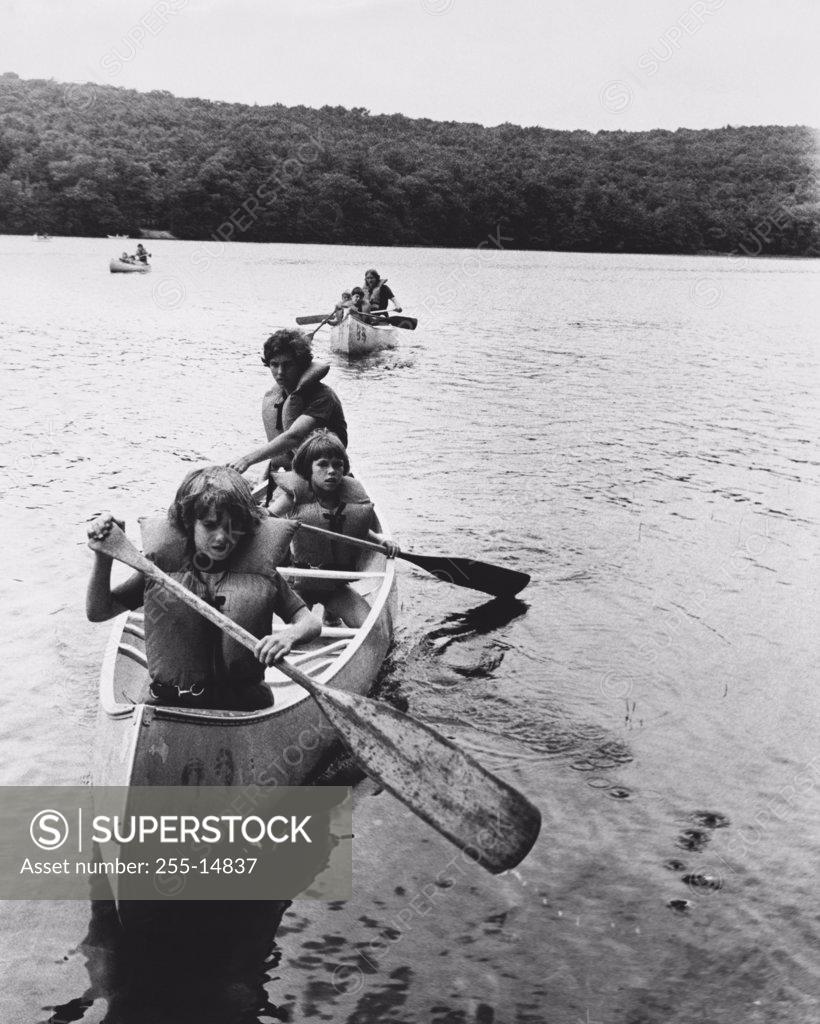 Stock Photo: 255-14837 High angle view of people canoeing on a lake