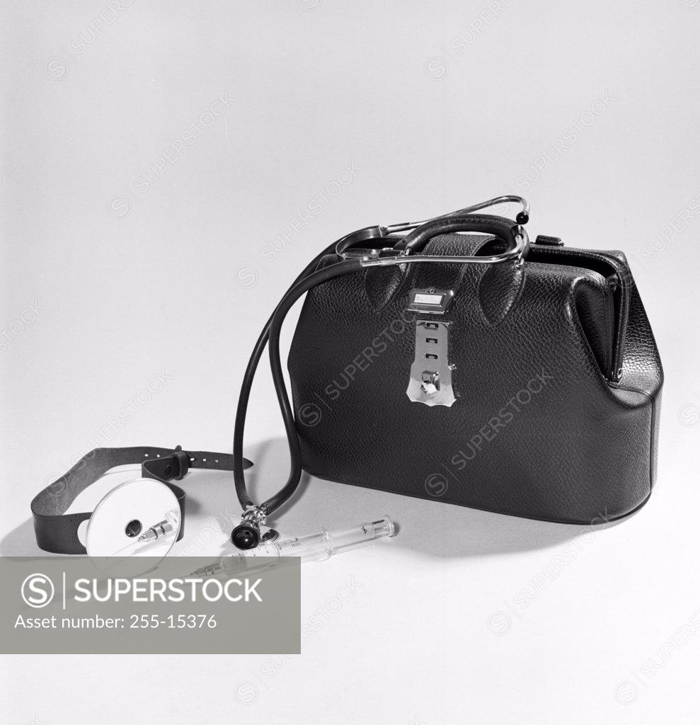 Stock Photo: 255-15376 Close-up of medical equipment near doctor's bag, 1950s