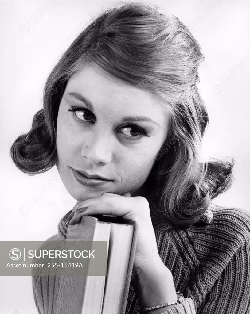 Vintage photograph of young woman with book