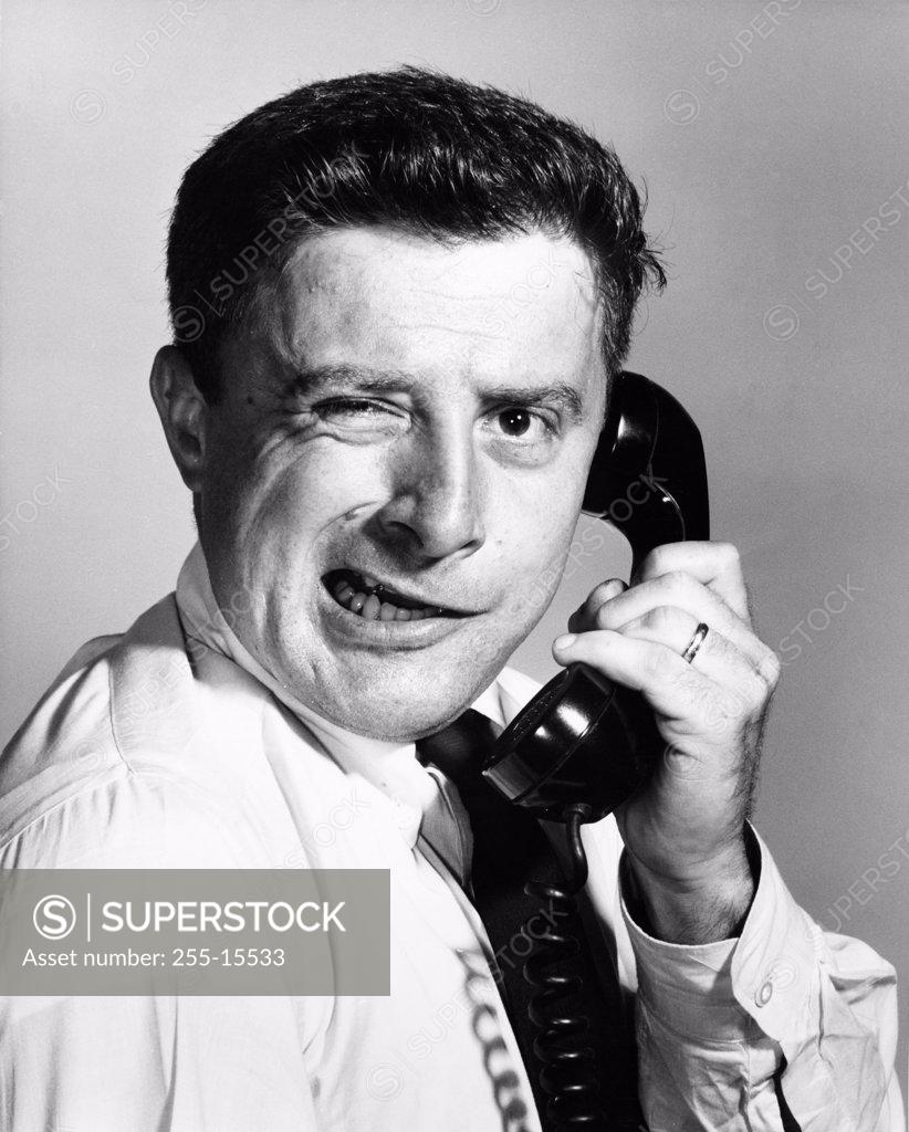 Stock Photo: 255-15533 Close-up of a businessman using a telephone