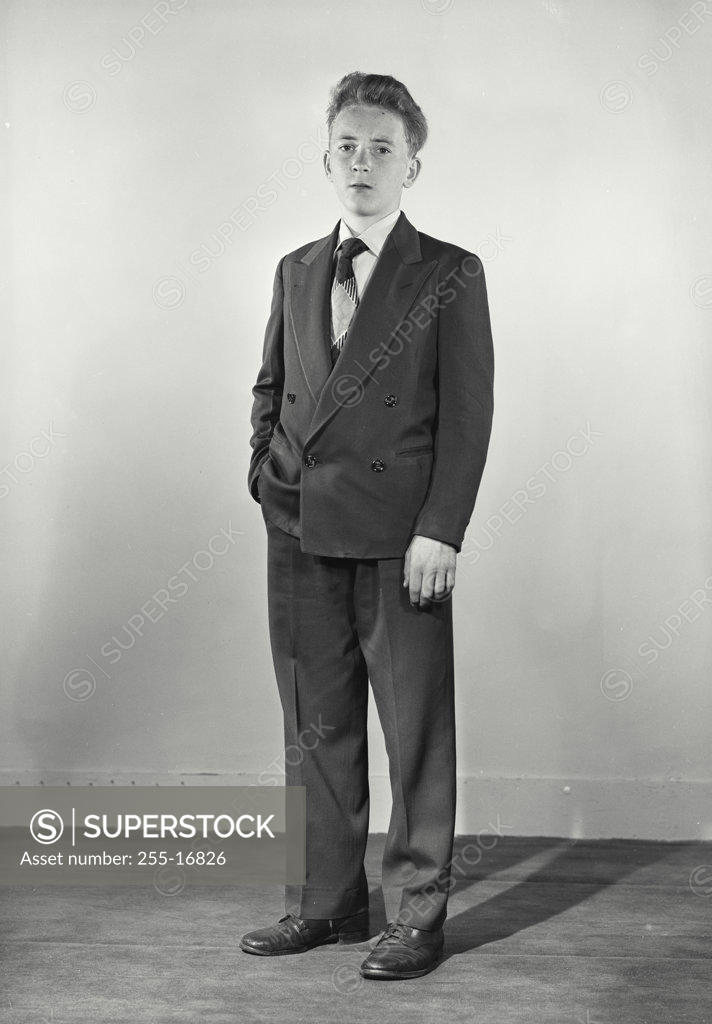 Stock Photo: 255-16826 Portrait of a boy standing with his hand in his pocket