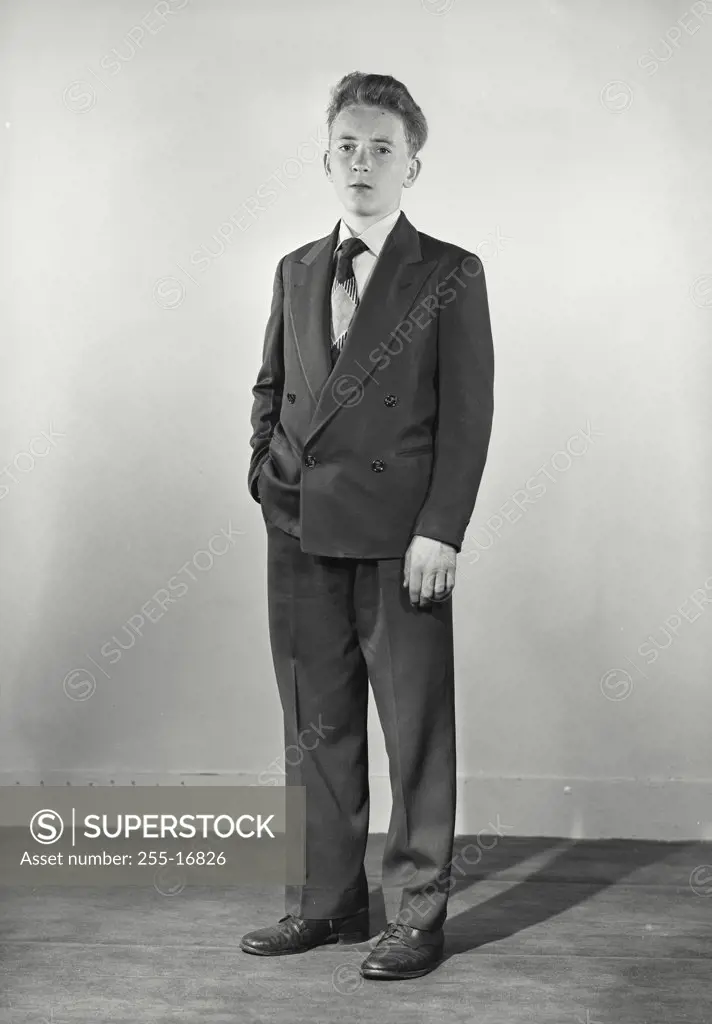 Young man dressed in Suit hand in pocket