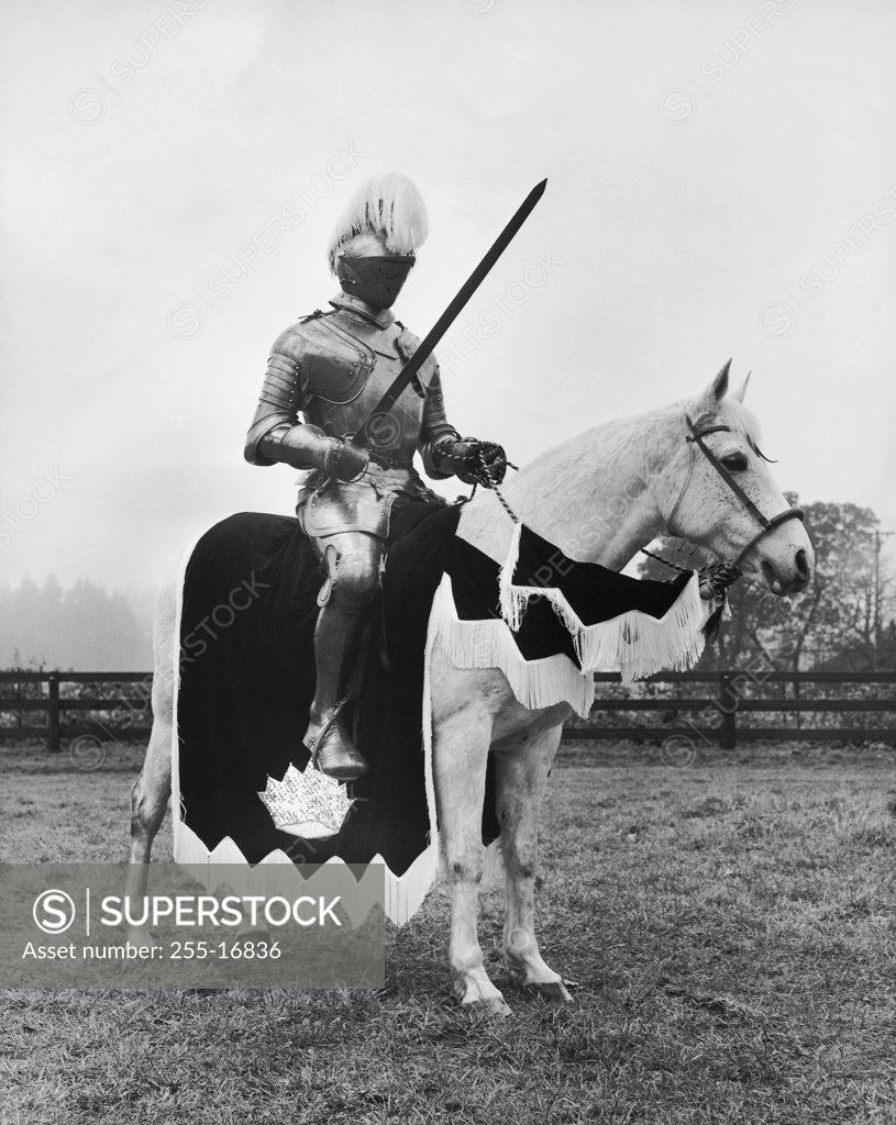 Stock Photo: 255-16836 Knight in armor riding a horse
