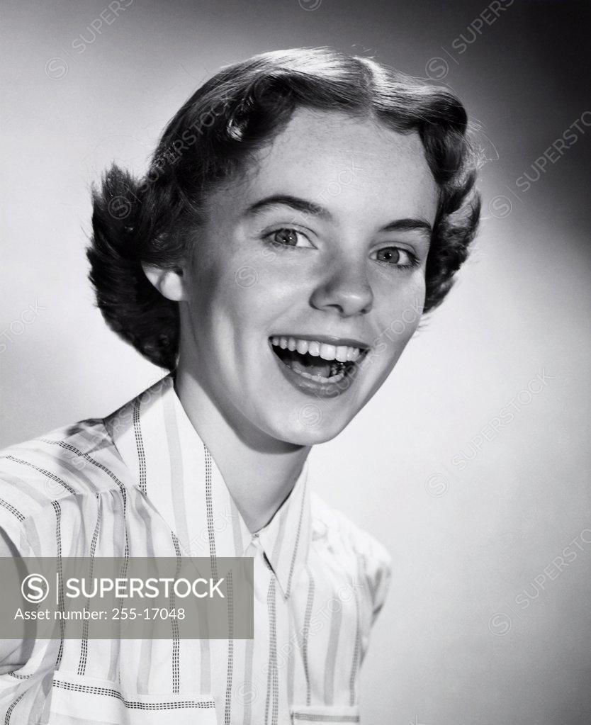 Stock Photo: 255-17048 Portrait of a teenage girl laughing