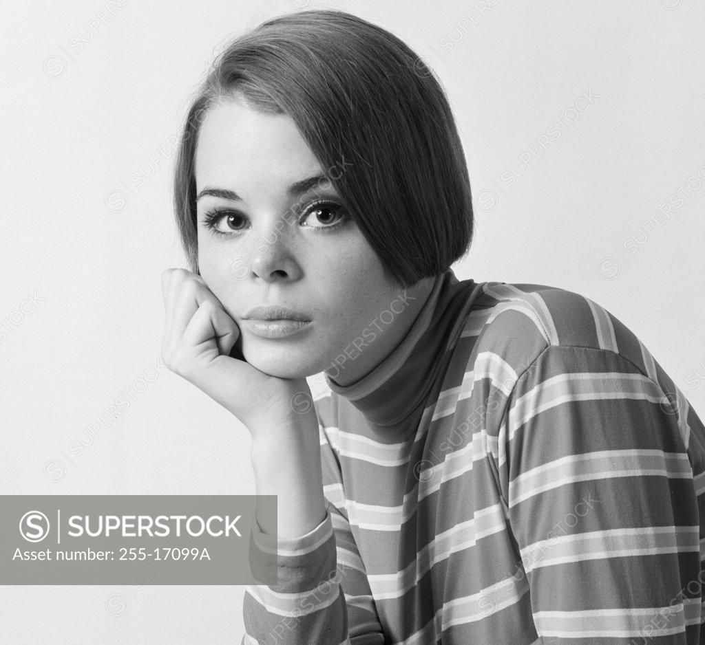 Stock Photo: 255-17099A Portrait of a teenage girl with her hand on her chin