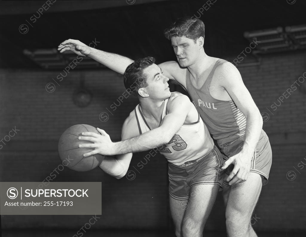 Stock Photo: 255-17193 Two young men playing basketball