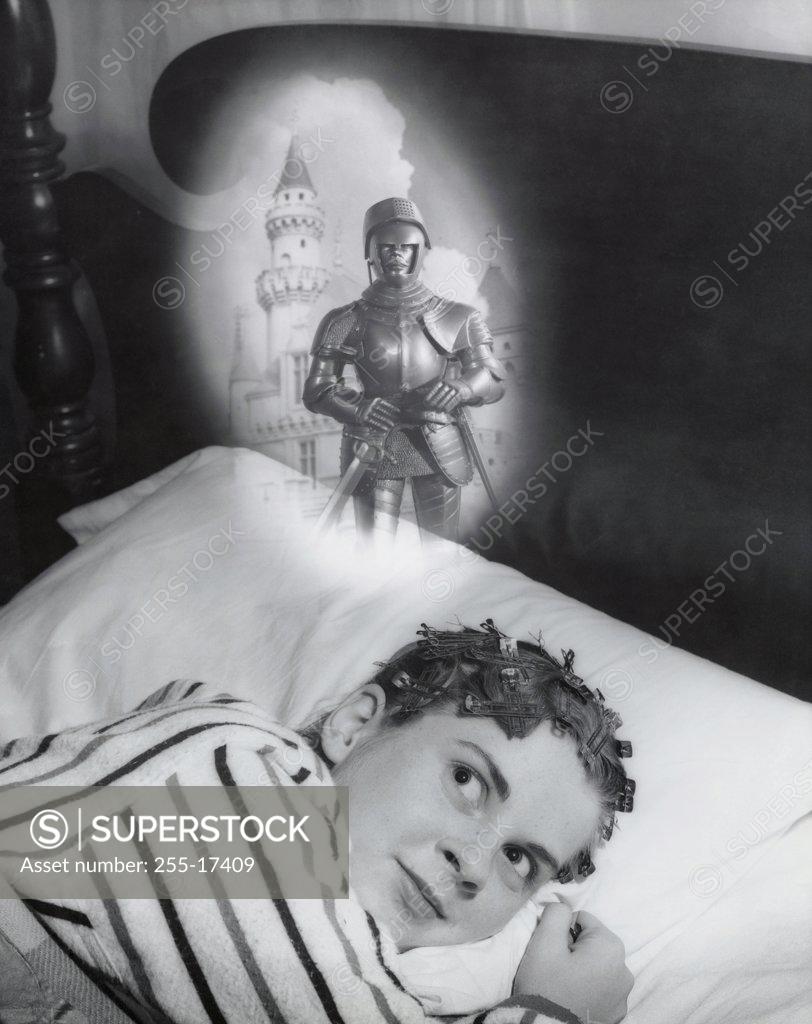 Stock Photo: 255-17409 Close-up of a teenage girl lying on the bed and dreaming, 1959