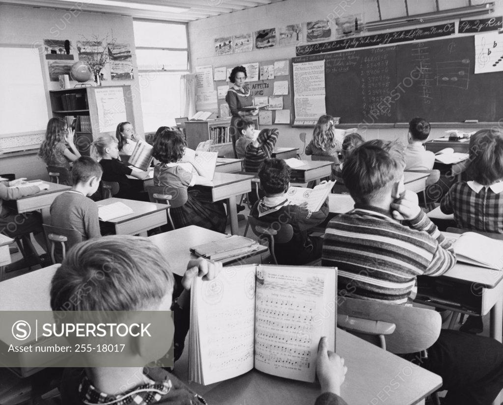 Stock Photo: 255-18017 School children in a classroom with a female teacher